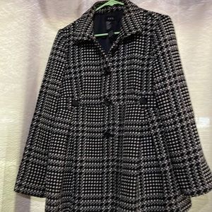 Stylish winter coat black and white stripes.